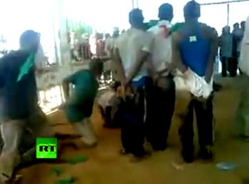 Libyan rebels cage black Africans in zoo, force feed them flags.  