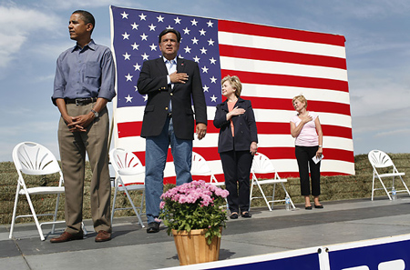TIME writes, "Respect - Senator Barack Obama, Governor Bill Richardson, Senator Hillary Clinton and Ruth Harkin stand during the national anthem." 