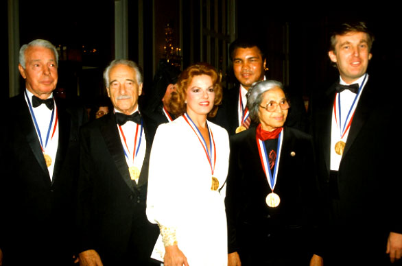 "The full, uncropped photo includes not just Trump and Parks, but also Muhammad Ali, Joe DiMaggio, Victor Borge, and Anita Bryant. (Parks died in 2005, and Ali in June.) All were receiving the Ellis Island Medal of Honor, which is given by the National Ethnic Coalition of Organizations.'” - TheWrap 