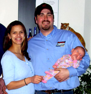 What a nice looking family, Erik so comfortable with the baby he picks her up like a sack of potatoes . . . and she loves it.  