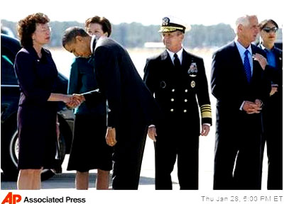 U.S. President Barack Obama bows to Tampa Mayor Pam Iorio at MacDill Air Force Base on January 28, 2010, in Tampa, Florida.   Iorio had honored CAIR annually in Tampa with its own day in November 2008, acknowledging the large amout of Muslims living in the area.  