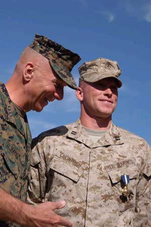 Marine Capt. Brian R. Chontosh received the Navy Cross Medal from the Commandant of the United States Marine Corps, Gen. Michael W. Hagee, during an awards ceremony Thursday at Marine Corps Air Ground Combat Training Center, Twentynine Palms, Calif.